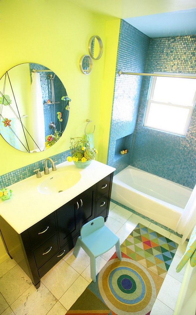 Rustic bathroom with clawfoot bathtub in yellow and vanity in blue
