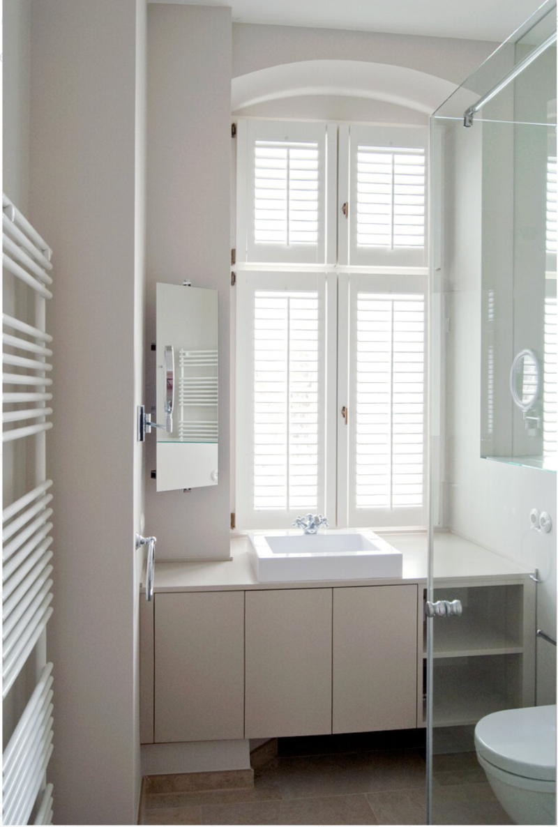 Artprojekt Interior Design Altbau Kreuze bathroom, this image shows the a white sink on a beige cabinet.