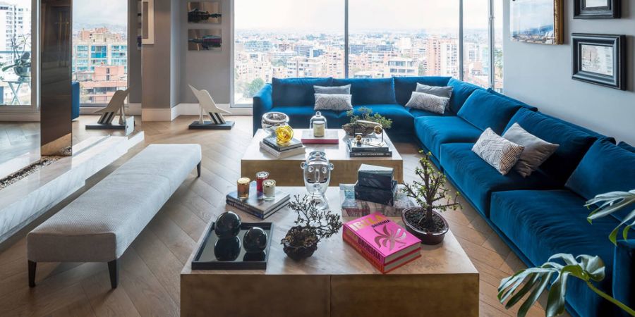 blue sofa, pillows, center tables, decorative elements