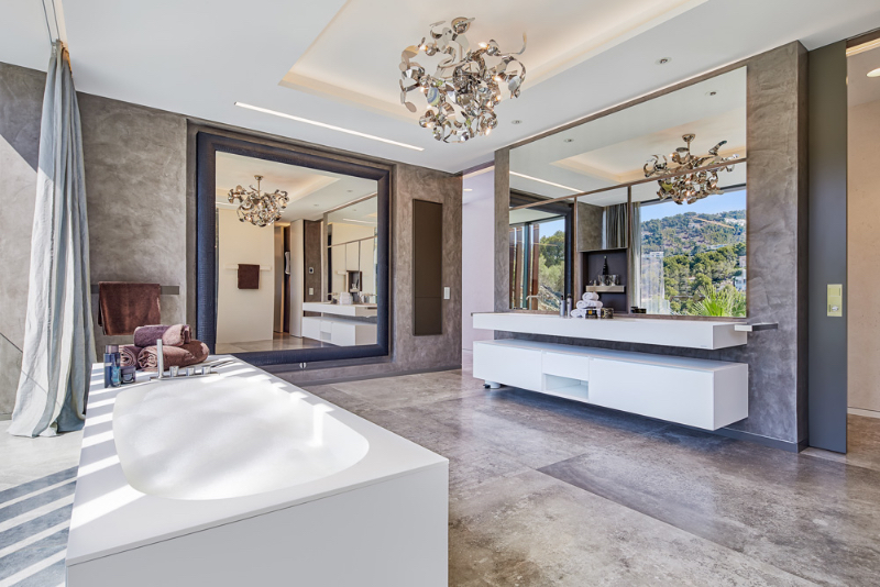 Master Bathroom Designs by Berlins Finest Interior Designers Son Vida master bathrooms design with a bathtub and a luxurious chandelier.