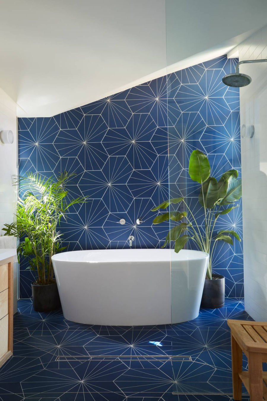 bathroom accessories, blue tile bathroom with potted plants and white bathtub