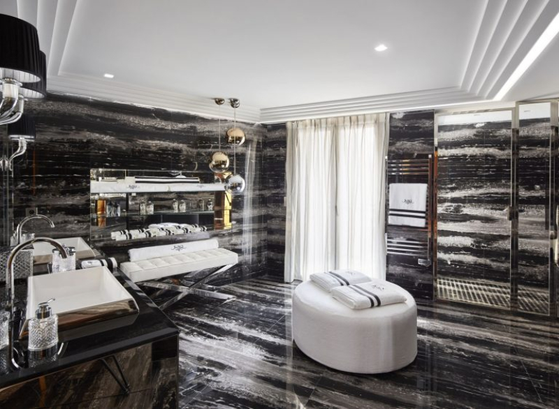 Master Bathroom Design by Stéphanie Coutas. This bathroom covered in marble, with leather benches and pouffes to bring us comfort