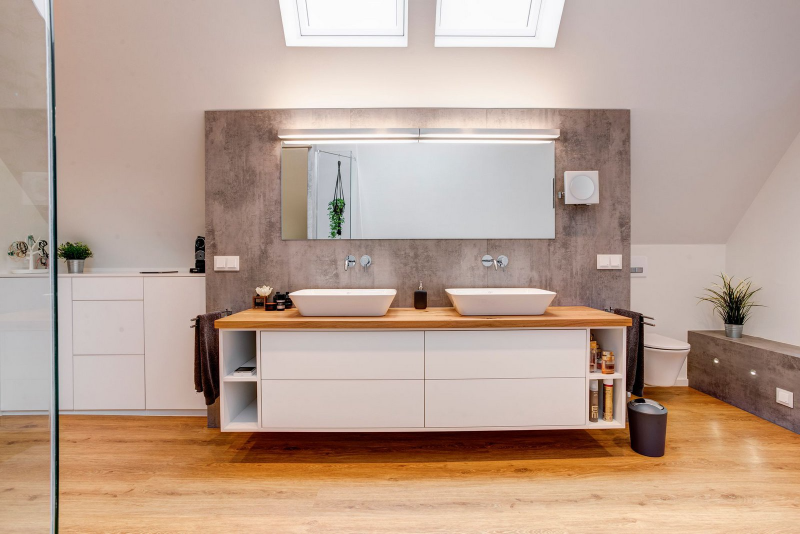 Bathroom Interior Design Ausbau Dachgeschoss­wohnung in Fachwerkhaus with 2 white washbasin on an all white cabinet