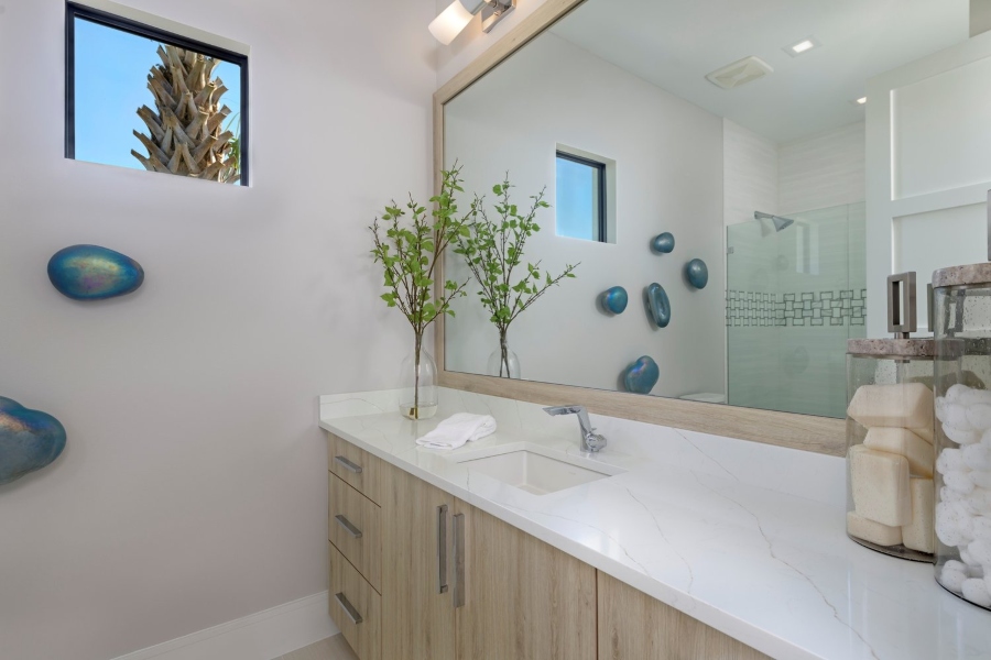 This bathroom is elegant  and very stunning, with mid century accents, lighting, and shapes that will take your breath away. That still conjures up any classic look.