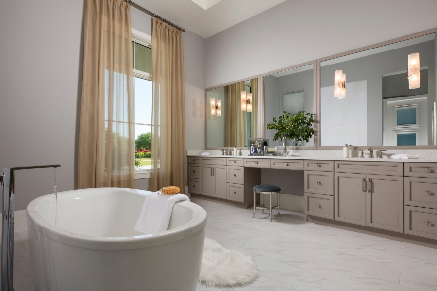 The neutral to warm tones and clean design of this lovely and luxurious bathroom convey serenity.