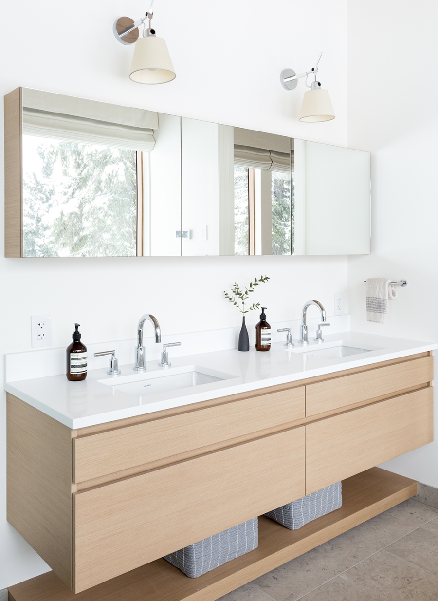 Bathroom Design With Sophie Burke Design. This master bathroom has a cabinet in wood with a countertop in white.