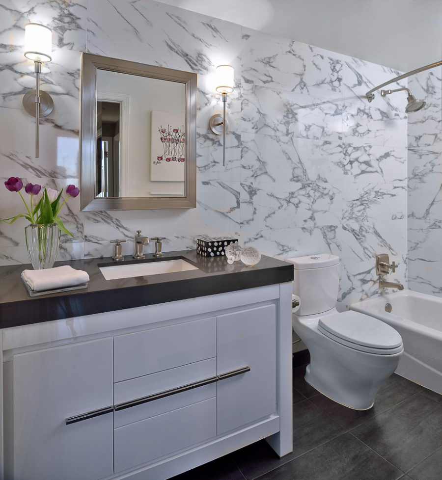 Bathroom Interior Design From Amilee Wendt. A bathroom with marble walls and white furniture.