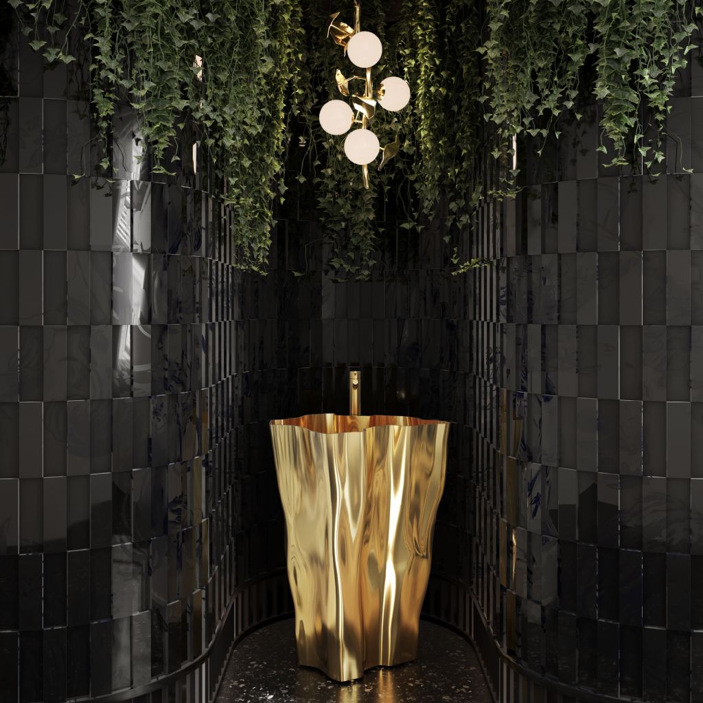 Luxurious powder bathrooms featuring the Eden Pedestal Sink in polished gold, deep black glossy tiles, Hera Pendant Lamp, cascading greenery, and terrazzo flooring, blending nature-inspired elegance with modern design.