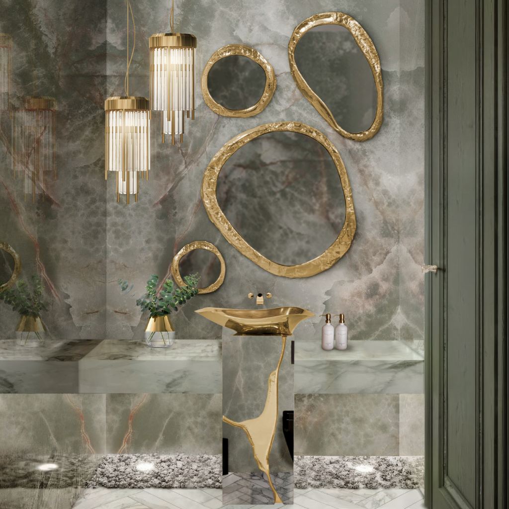 Opulent powder bathrooms featuring green marble walls, the Lapiaz Pedestal Sink, Halo Mirror, and Pharo Pendant Lamp, creating a luxurious, contemporary, and artful bathroom sanctuary.