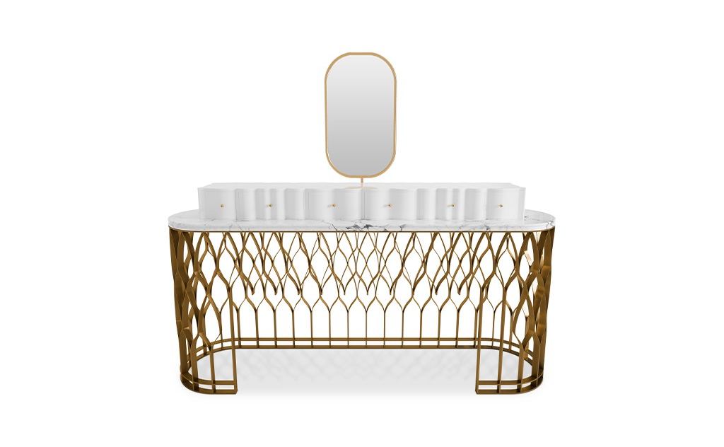 Mecca Vanity Table with brushed brass columns and Carrara Marble top, complementing luxury closets to create a refined and timeless interior.