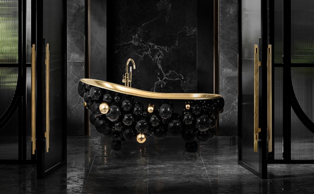 Dark contemporary master bathroom featuring the Newton Bathtub by Maison Valentina, a sculptural black and gold design surrounded by subdued lighting for a luxurious, mysterious ambiance.