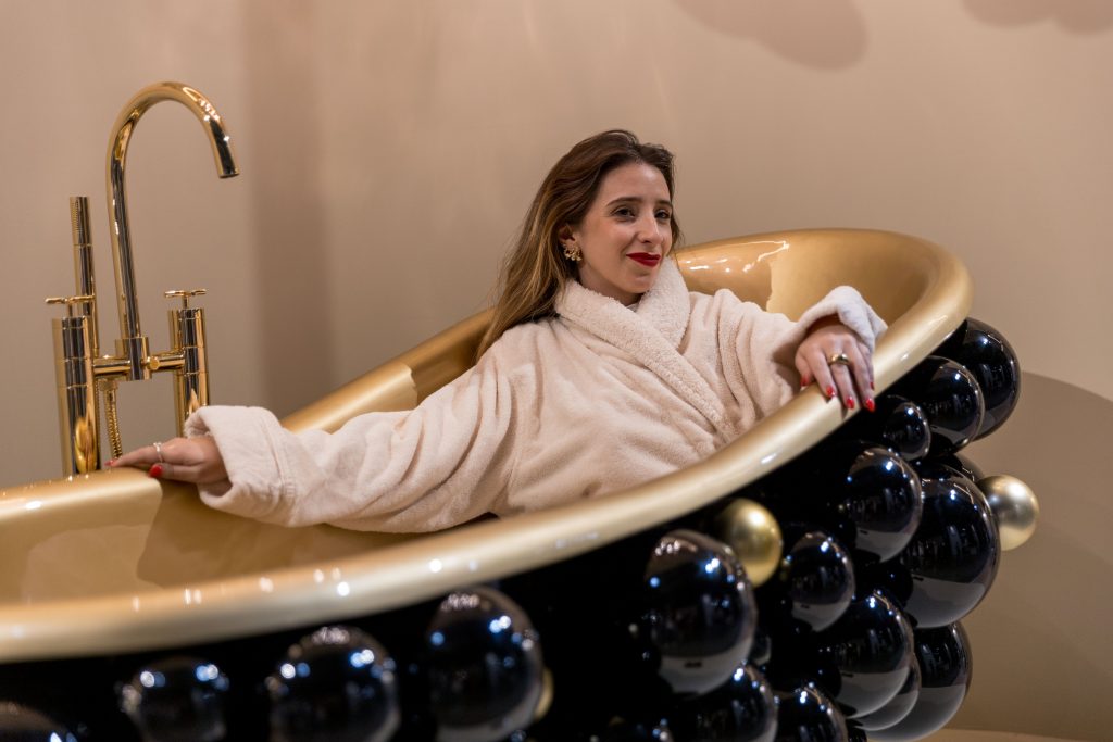 Visitor experiencing the iconic Maison Valentina Newton Bathtub at iSaloni 2026 Milan Design Week