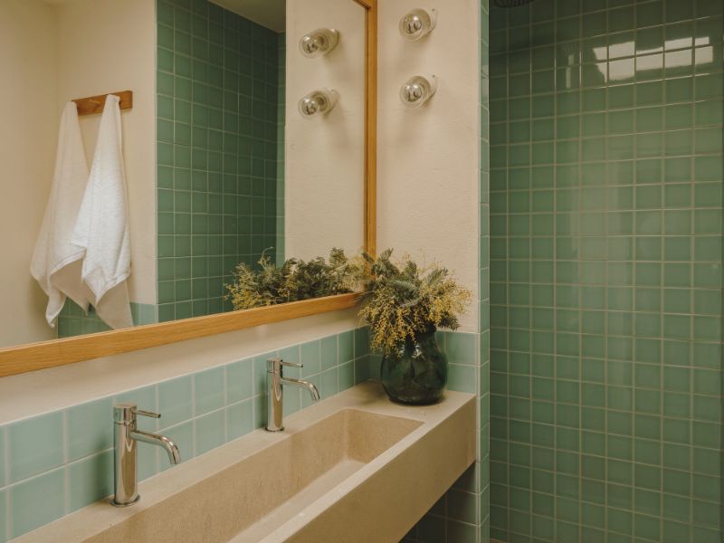nude sink, metallic taps, rectangular mirror