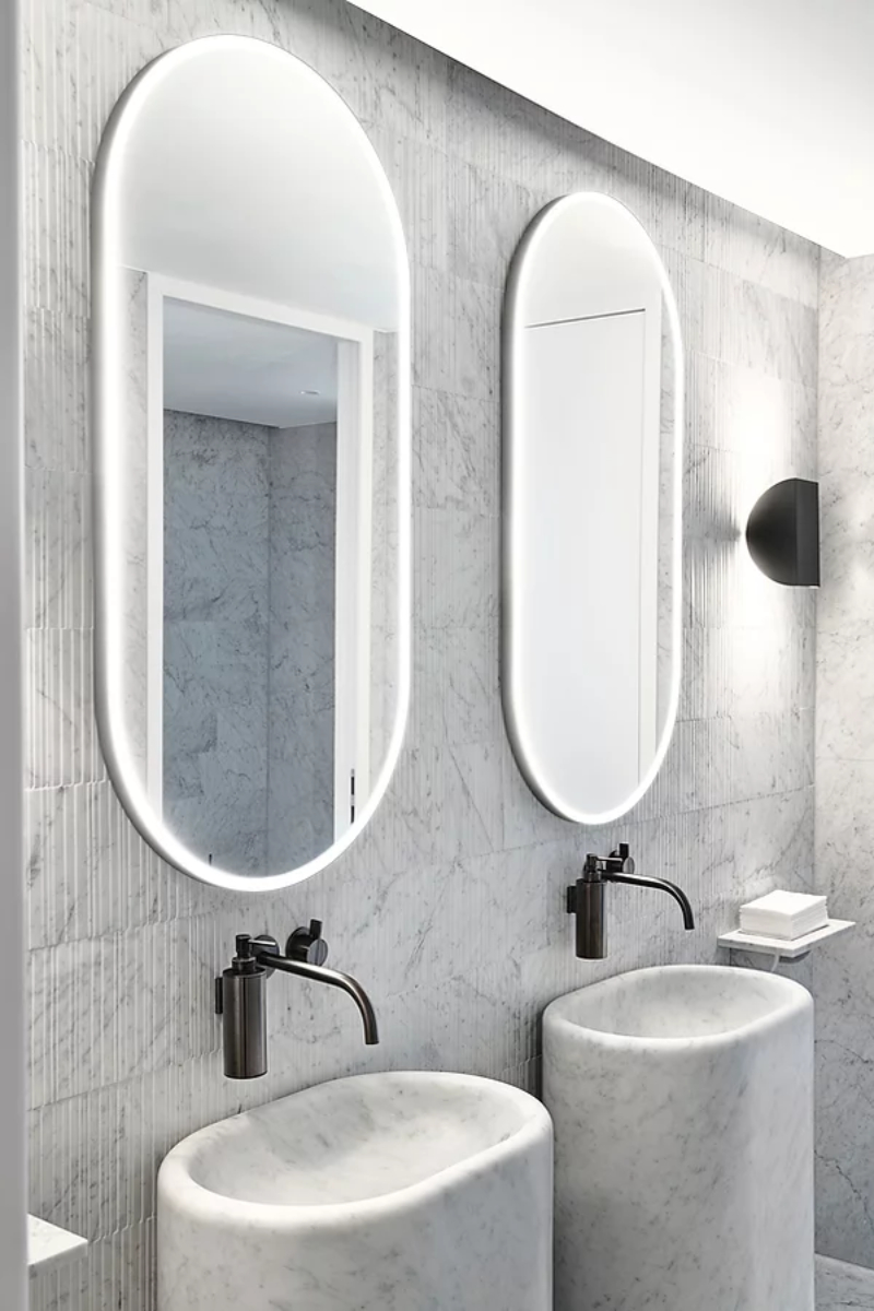 office e all-white luxury bathroom ideas with two all-white freestanding and 2 oval mirrors.