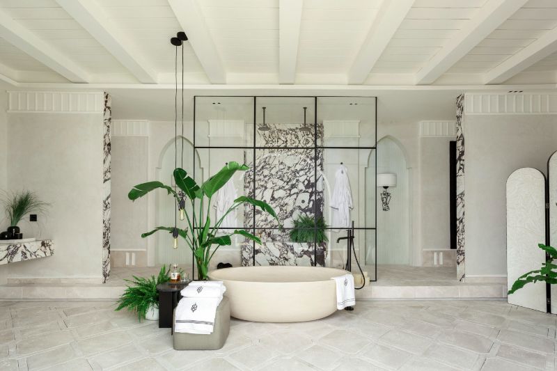 bathroom by marisa gallo with white bathtub