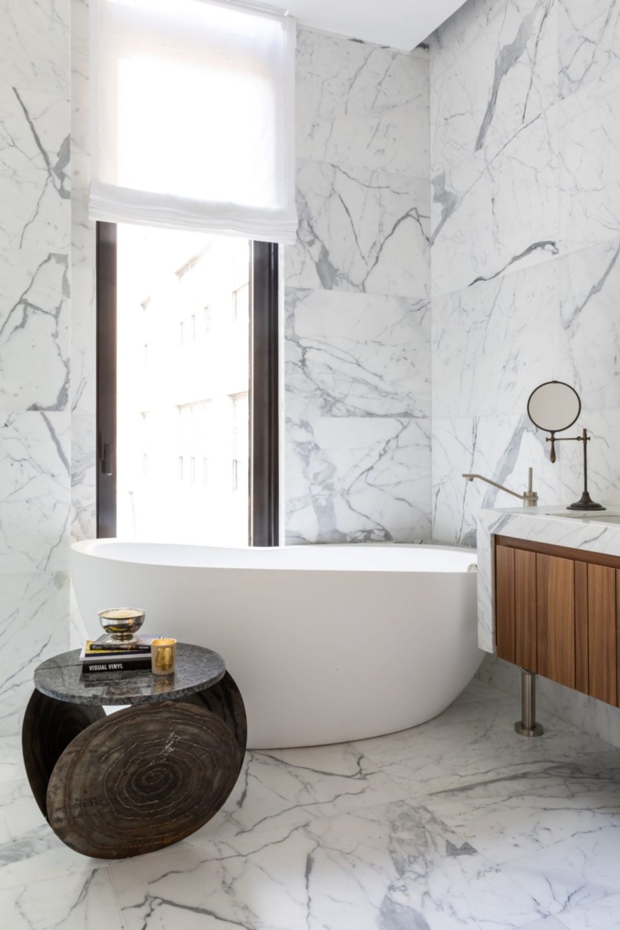 White marble bathroom with white bathtub by Nicole Fuller Interiors - 111 Leroy Project