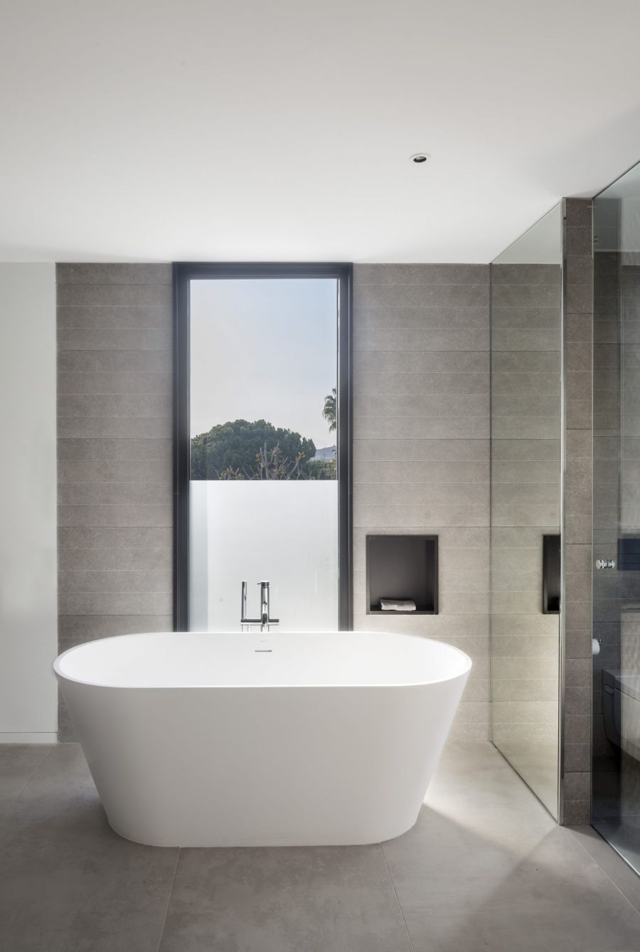 bathroom by zest architecture with white bathtub