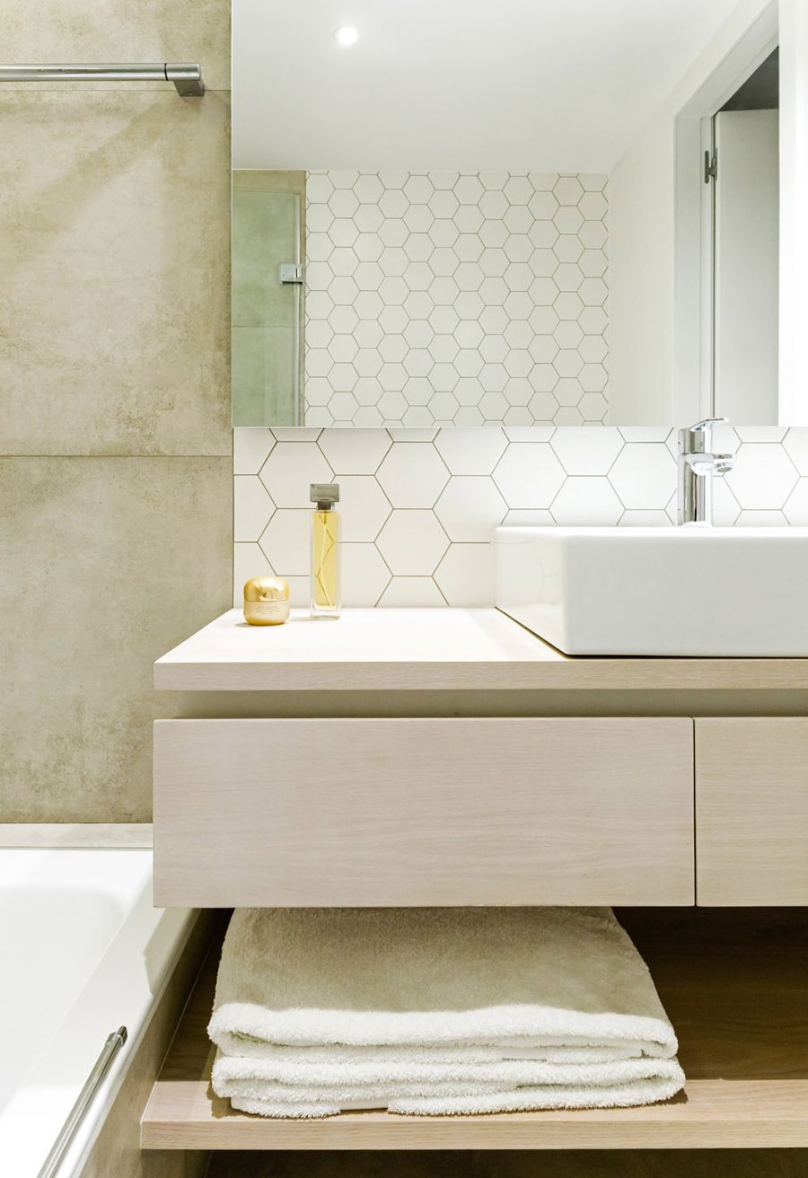 bathroom by zest architecture with white sink and rectangular mirror