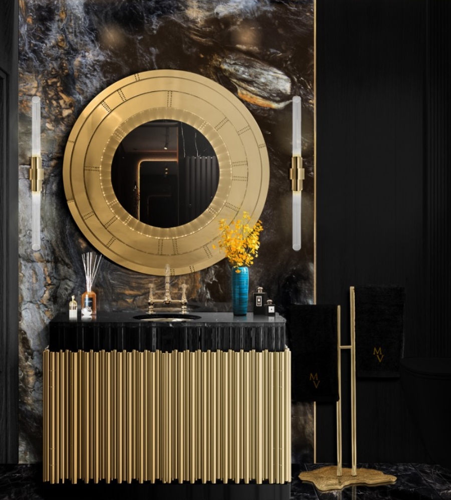 Ideas to decorate the bathroom by Beyond Beige. This sumptuous bathroom has the Symphony Single Washbasin, the Blaze Mirror, and the Eden Towel Rack. It's wonderful because of the golden embellishments on the mirror and washbasin, as well as the black tones.
