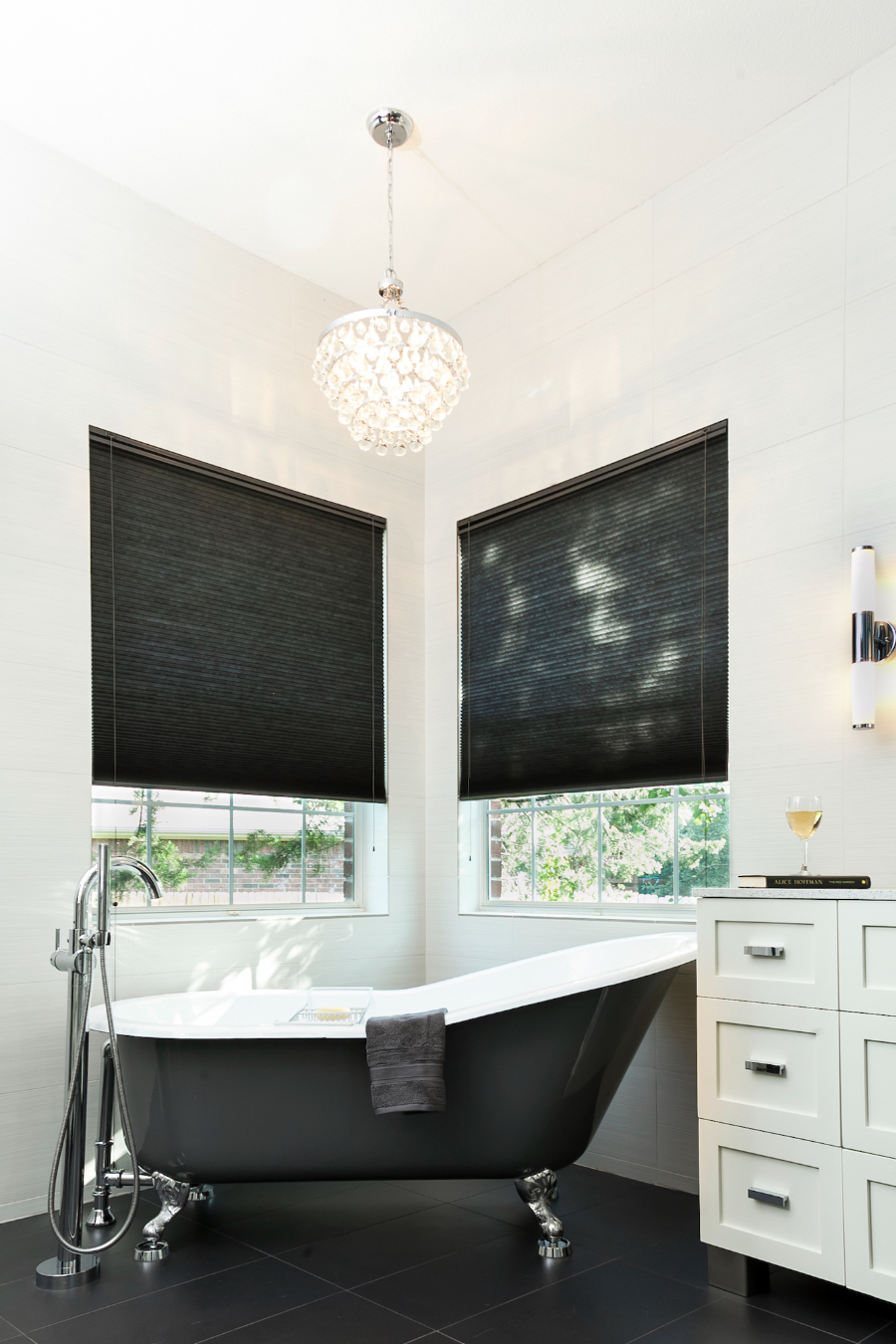 Allison Jaffe Interior Design: Bathroom Design Ideas. A black and white bathtub in the corner of the bathroom.